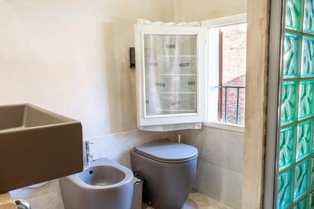 Casa Vacanze L'Angolo Fiorito Bettolle Esterno foto